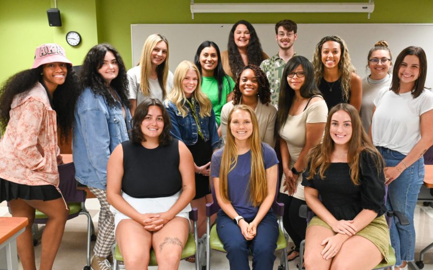 The first UTC ABSN cohort—Front row seated, from left: Addison Holt, Stephanie Peterson and Angela Livarchuk; middle row: Taniya Nichols, Colleen Roberts, Michaela Price, Gabby Turner, Jasmin Sifuentes, Kai Terry, Esther Obi, Sierra Davis, Kaylea-Beth Ware and Tori Rives; back row: Katelyn Nash and Graham Anderson. Not pictured: Allie Dexter.