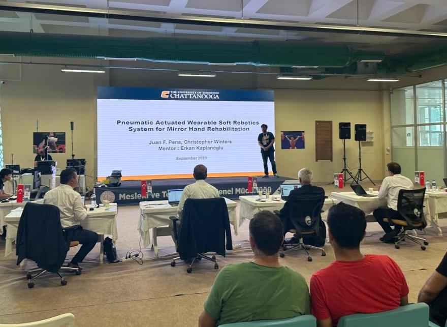 Senior Juan Pena makes his presentation at the 15th International MoNE Robot Competition in Turkey. Photo credit: College of Engineering and Computer Science