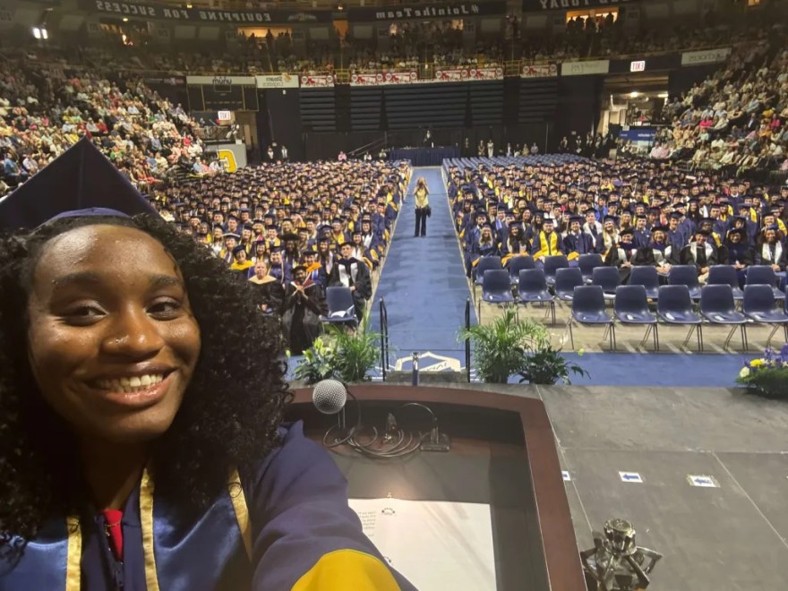 Following her remarks to UTC students of the Gary W. Rollins College of Business and the College of Health, Education and Professional Studies at the May 4 afternoon undergraduate commencement, Student Government Association President Chamyra Teasley took a selfie with the graduates.