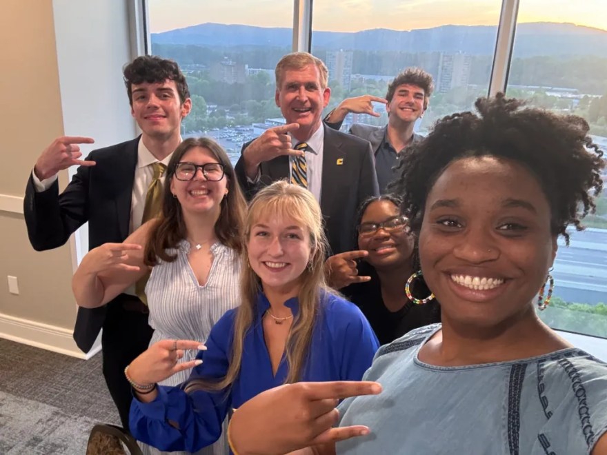 Dr. Steve Angle flashes the Power C with members of the Student Government Association (photo credit: Chamyra Teasley).