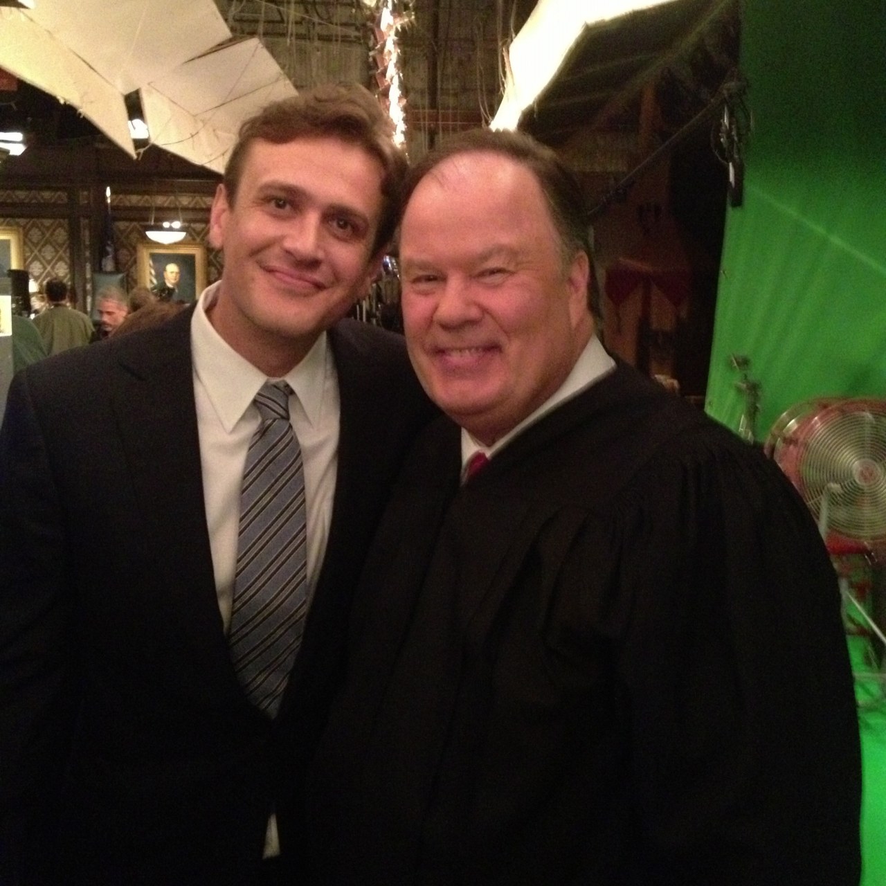 Dennis Haskins, wearing a judge’s robe, poses with actor Jason Segel on the set of “How I Met Your Mother.”