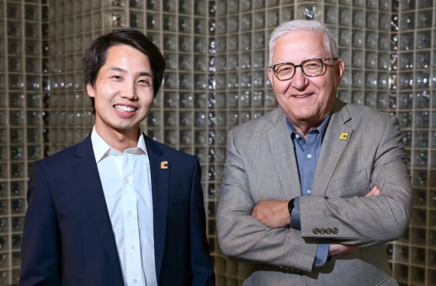 Dr. Tian Li, UTC assistant professor of physics and chief technology officer for the Quantum Center, left, and Vice Chancellor for Research Reinhold Mann.
