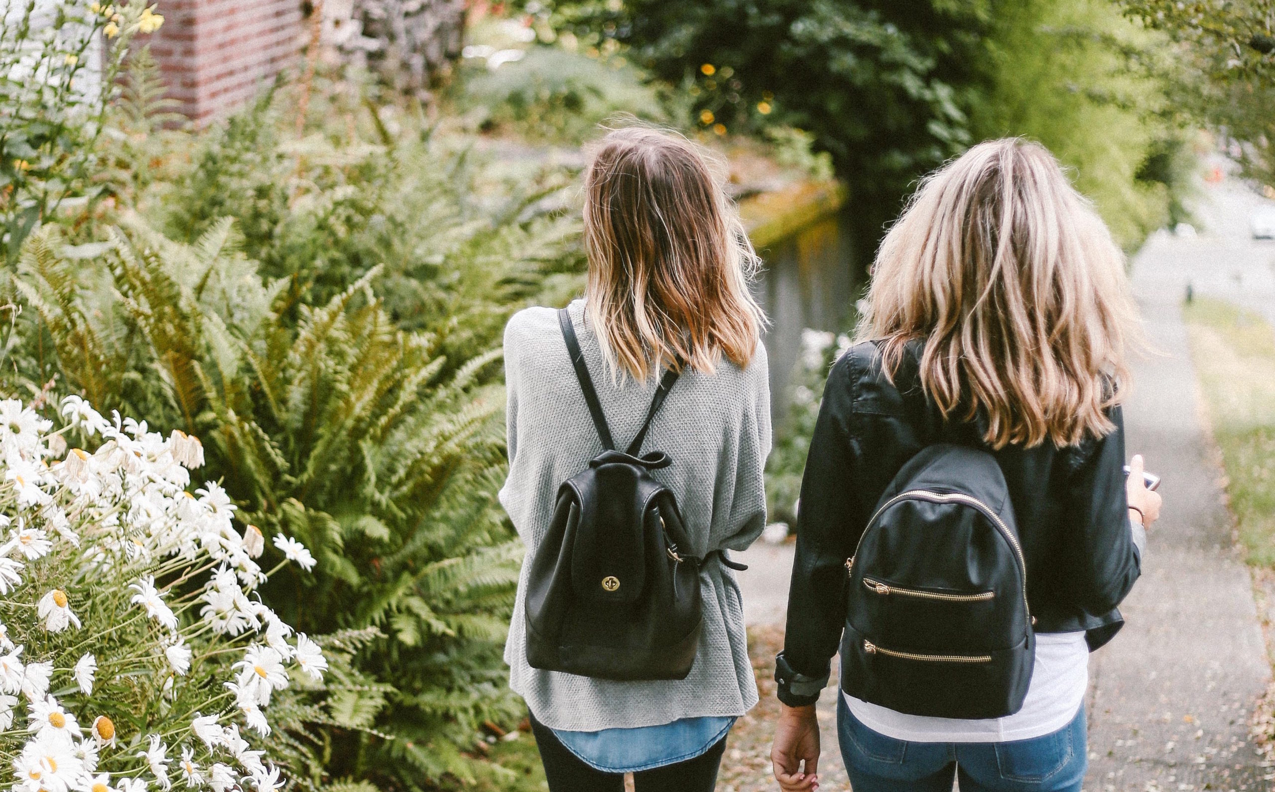 2 girls walking in the park