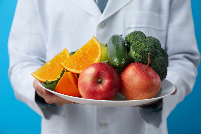 Doctor with healthy food - healthy nutrition concept