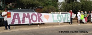 Supporters lined the main drag in Oracle, with bilingual or Spanish signs welcoming the the refugee children.