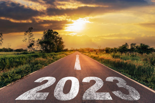 Empty Asphalt Road And New Year 2023 Concept Driving On An Empty Road To Goals 2023 With Sunset Stock Photo - Download Image Now - iStock