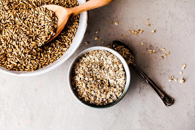 Top view of organic rolled oats in a bowl Top view of organic rolled oats in a bowl