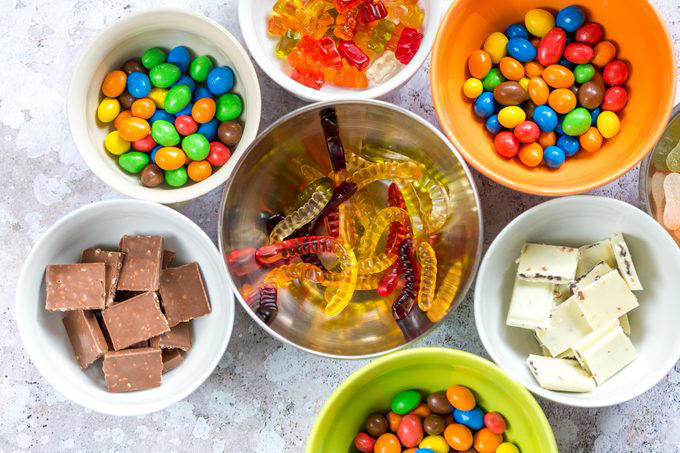 Overhead view of colorful candy and chocolate in bowls Overhead view of colorful candy and chocolate in bowls