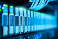 Detailed image of a server rack with glowing lights in a modern data center.