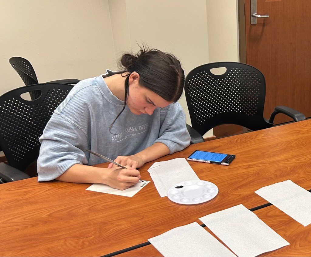 A student working with medieval archival materials. 