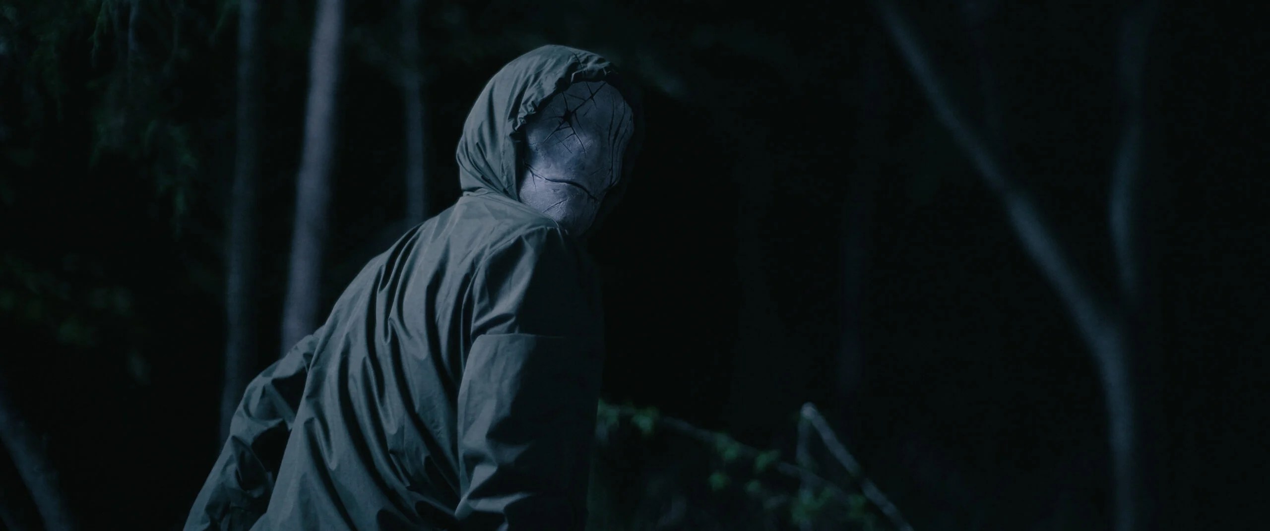 A terrifying masked killer emerging from the deep dark woods in the new Deathwoods horror trailer