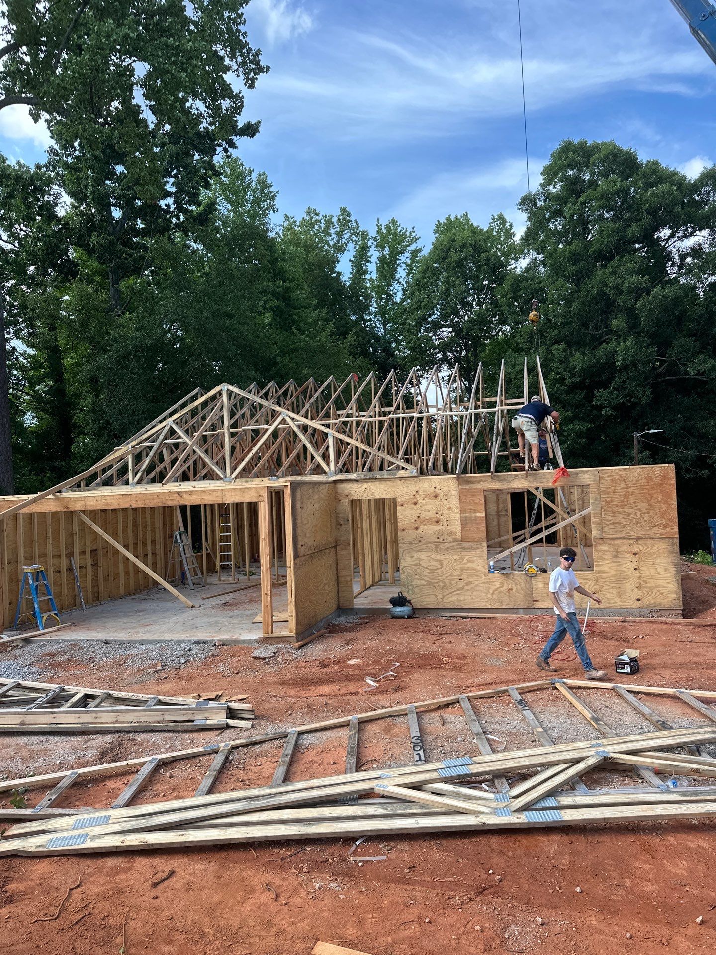 Exterior framing and crane work during ground-up construction