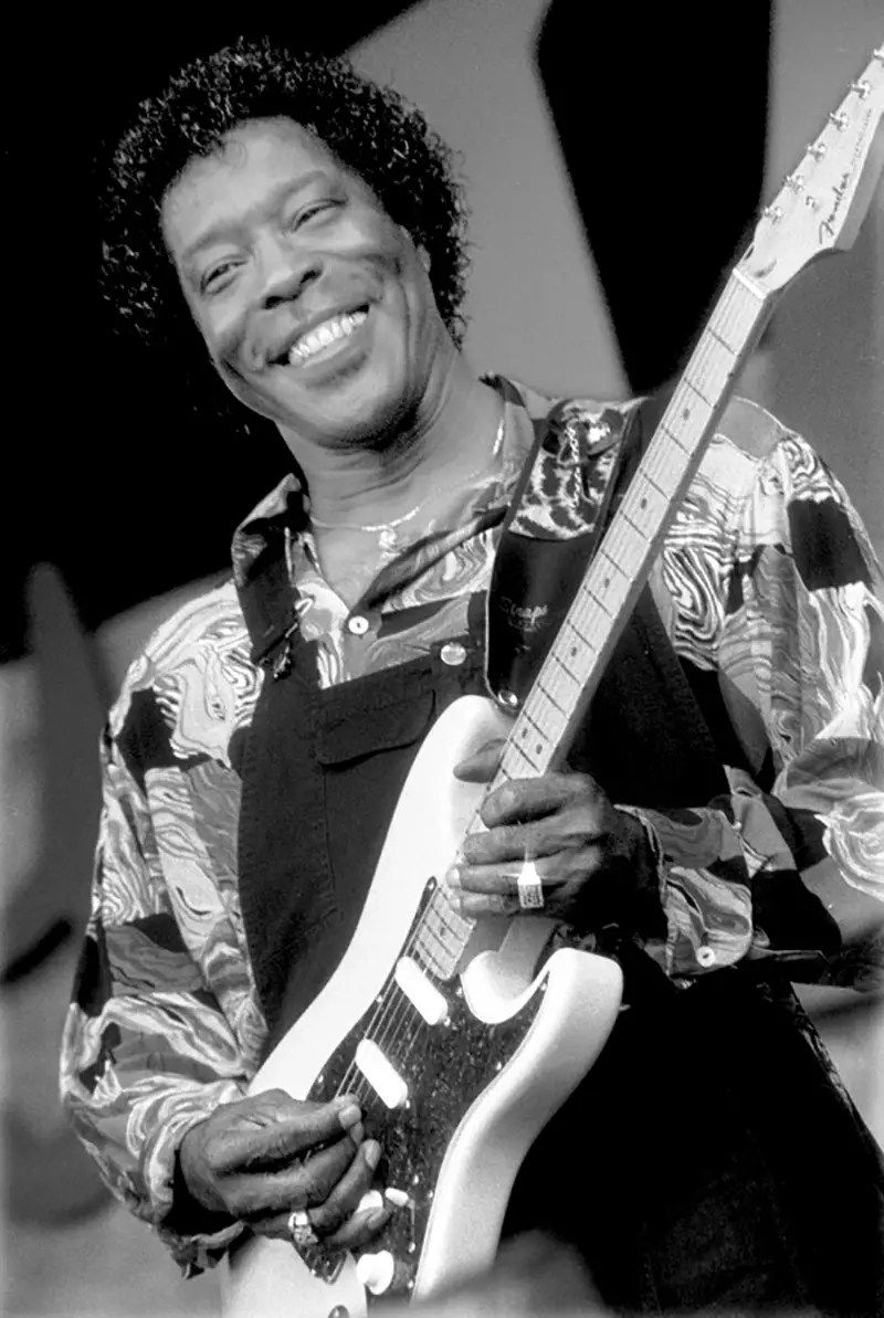 Buddy Guy performing on stage at a Chicago blues club