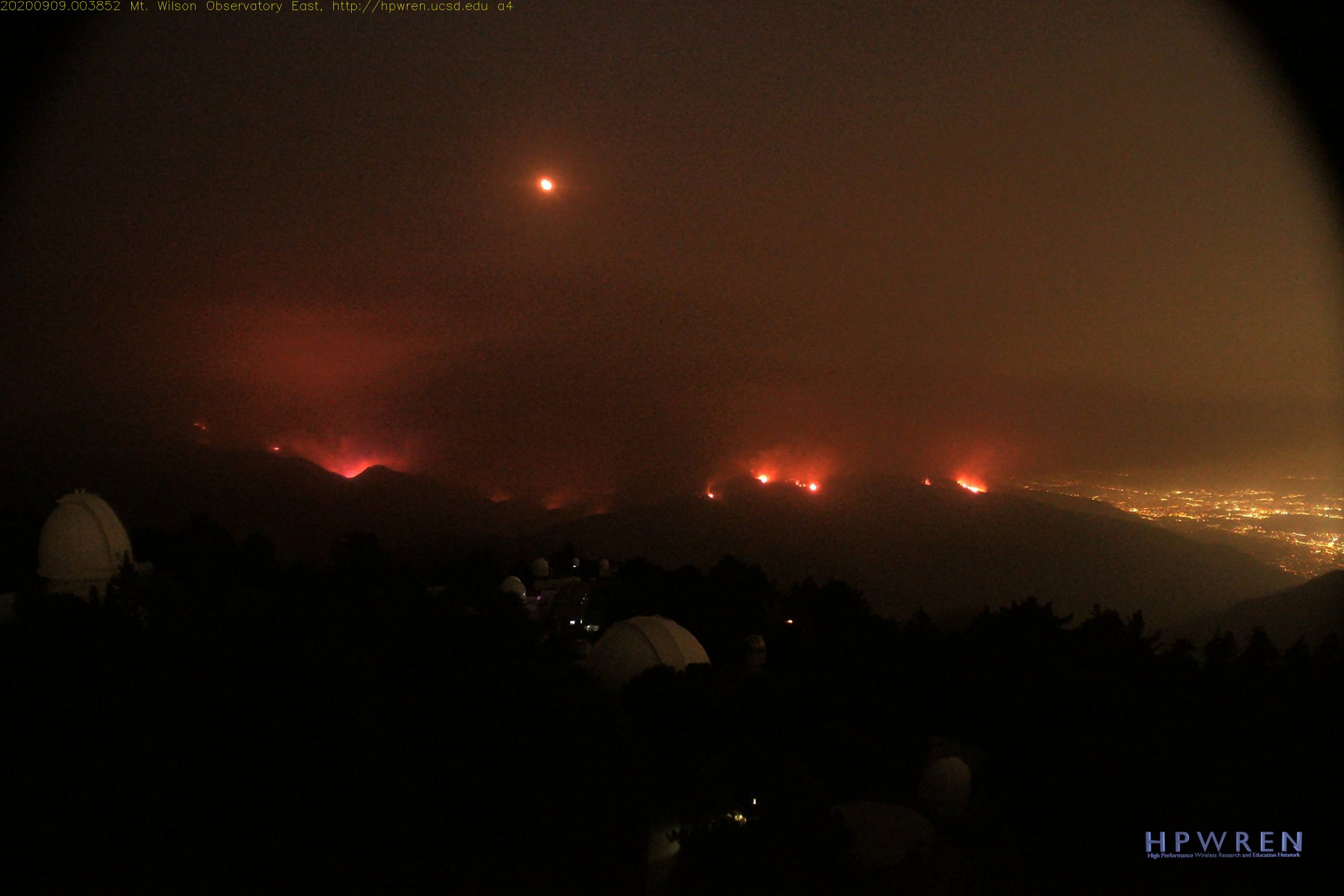 Night photo of flames burning near the Mt. Wilson Observatory.