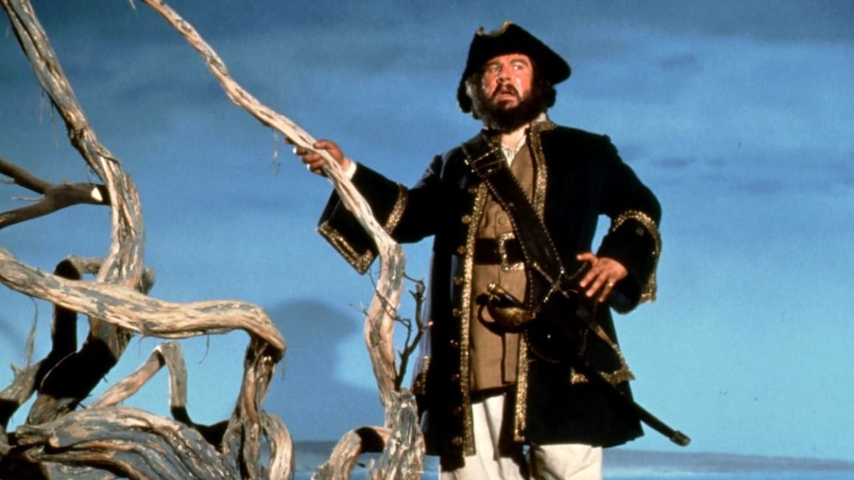 Peter Ustinov standing on the coast dressed in full pirate regalia in Blackbeard's Ghost