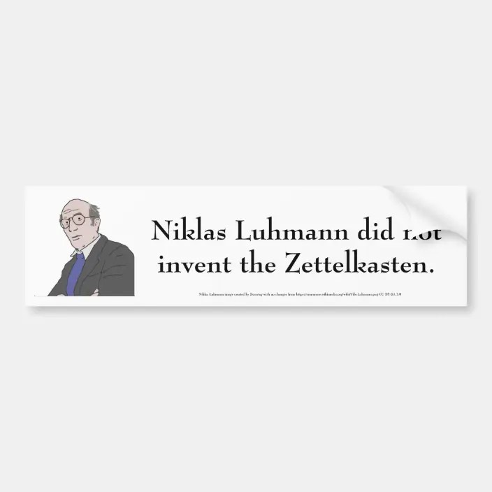 White bumper sticker with a cartoon image of Luhmann with text that reads "Niklas Luhmann did not invent the zettelkasten"
