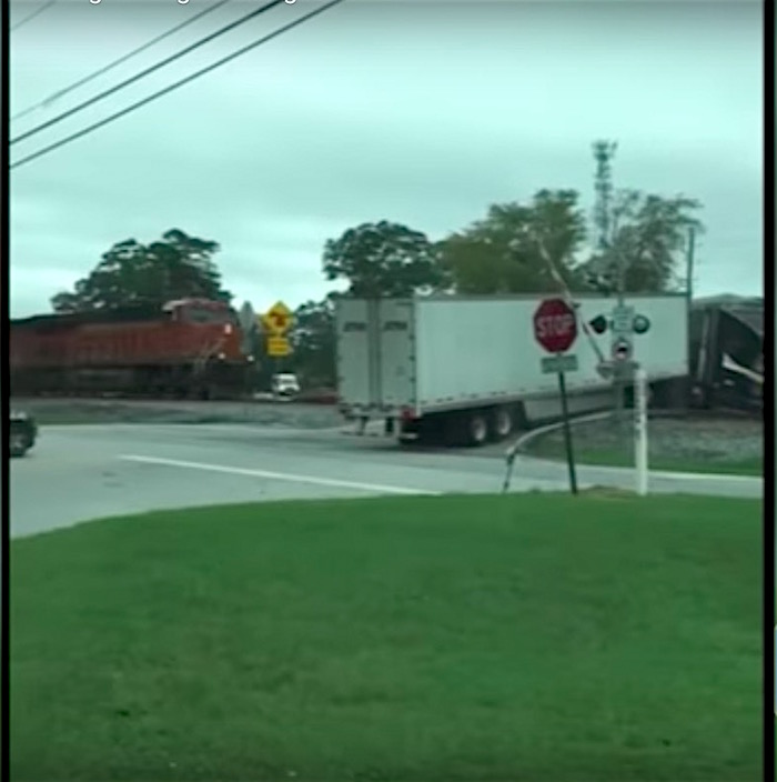 Watch: Train plows into semi-truck that is stuck on the tracks - Boing ...