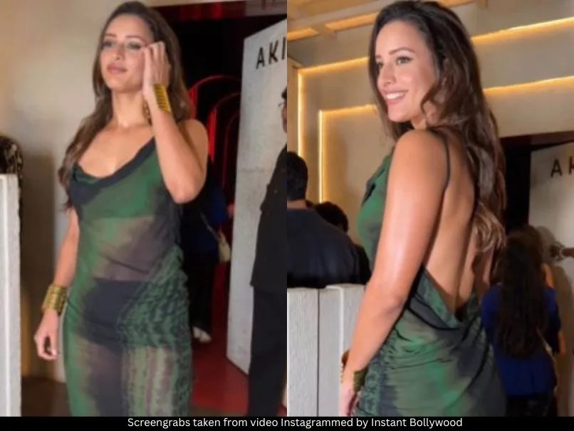 Triptii flaunting her toned back before gracefully turning to show off the front of the dress, striking stunning poses along the way.