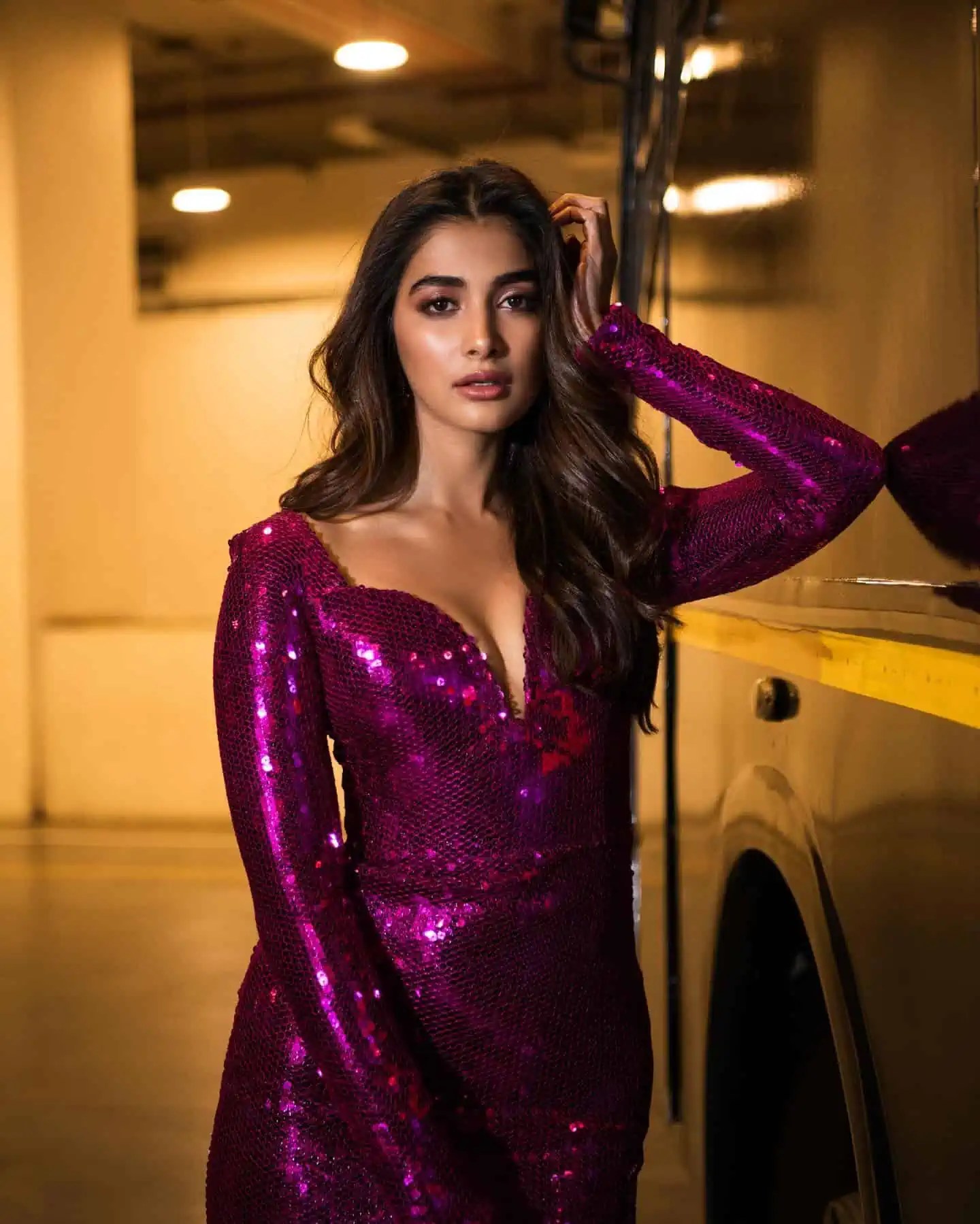Pooja Hegde wins heart  with her mesmerizing appearance in a captivating dark pink sequined gown.