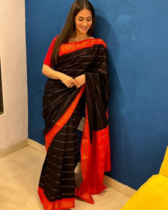 Elli AvrRam Stuns in a Black Saree with a Red Border, Paired with a Red Blouse