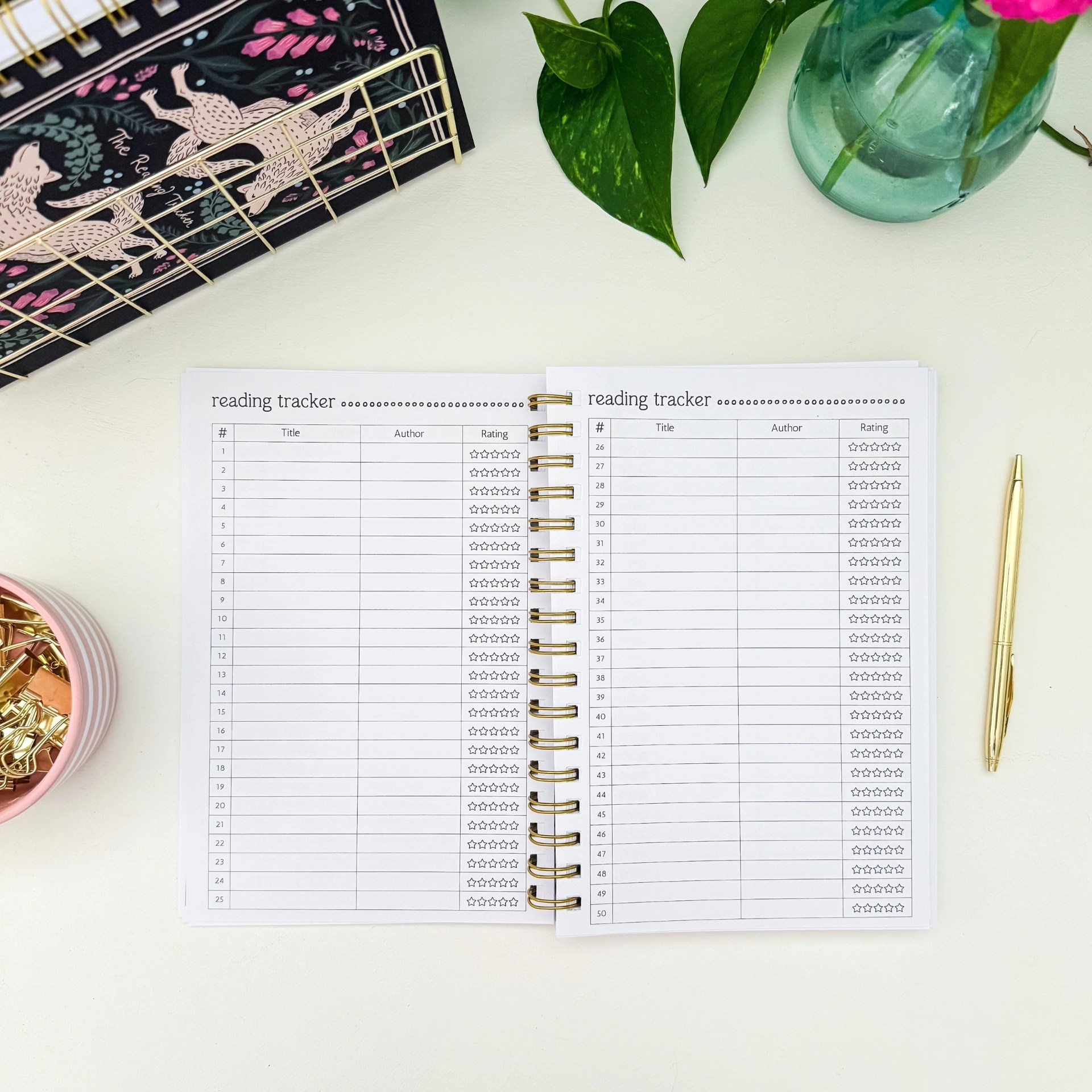 Reading Tracker interior spread with numbered book log pages for tracking title, author, and star rating