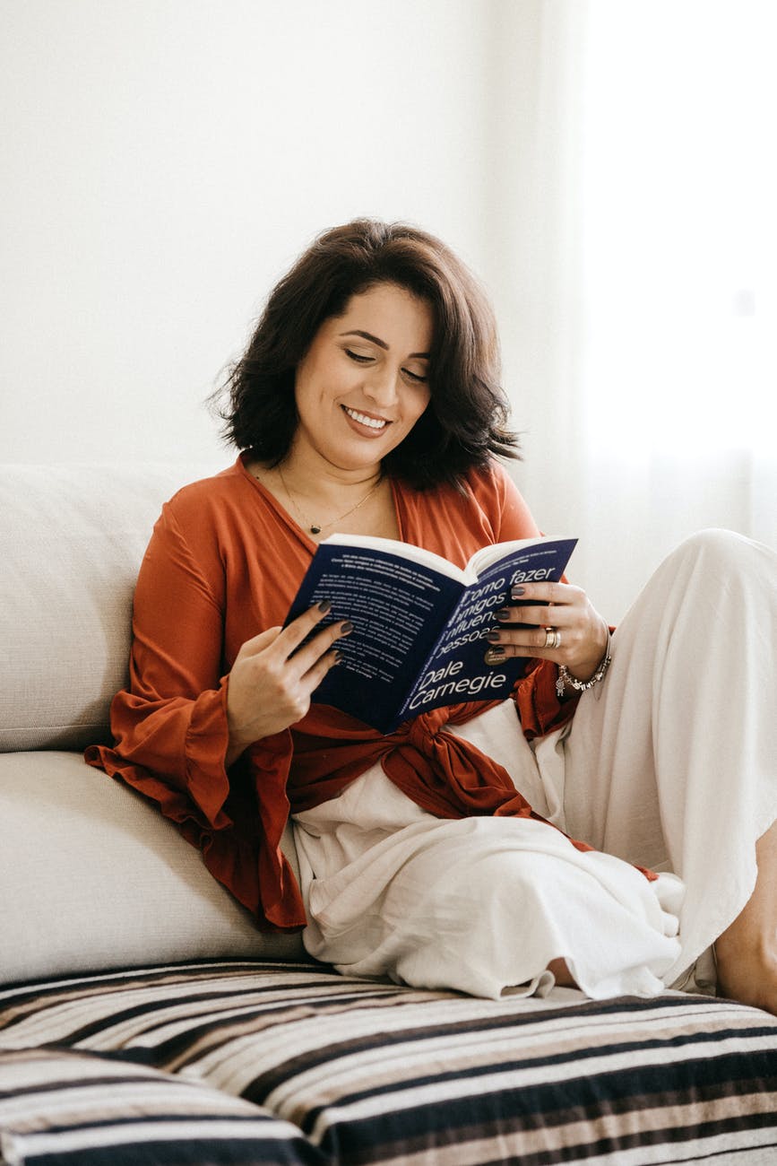 photo of woman reading book