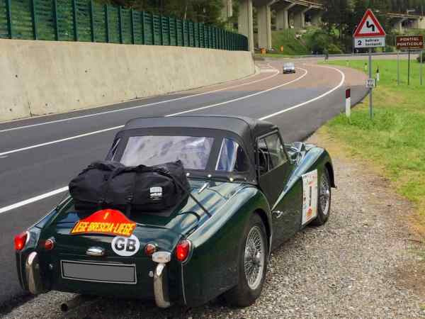 green triumph tr3 on the 2019 liege bresica liege road rally with a boot-bag luggage rack fitted