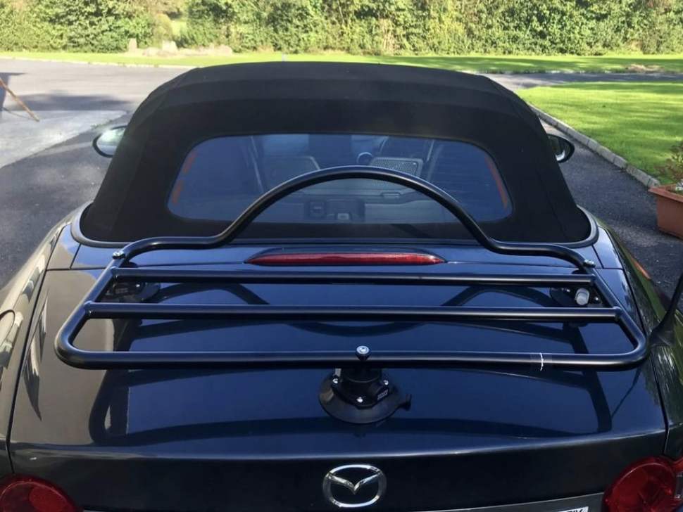 black mazda mx5 mk4 with a black boot rack fitted