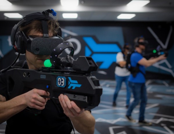 Man with VR headset and gun