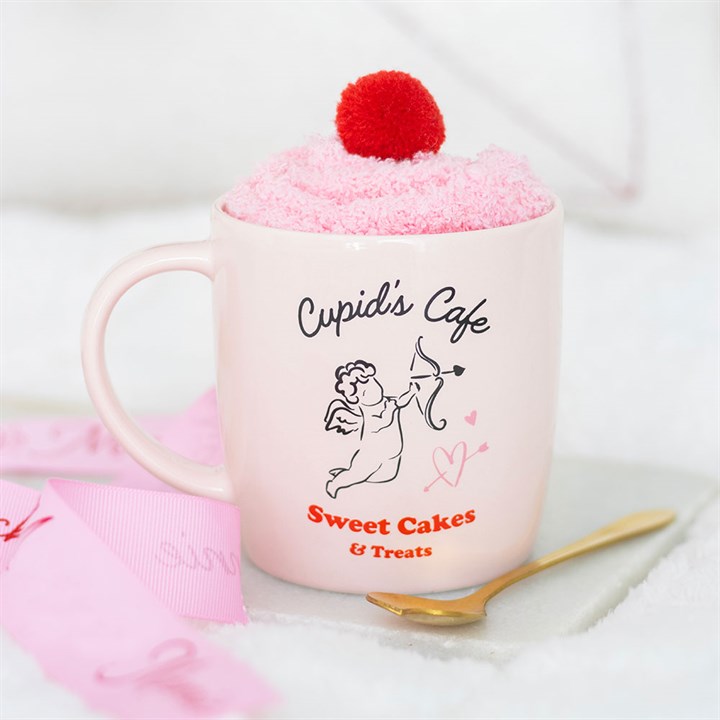 JUEGO DE TAZA, CUCHARA Y CALCETINES DE CUPID'S CAFE