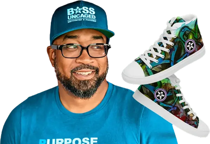 Get ready to unleash your entrepreneurial spirit! Picture this: A man rocking glasses, a blue cap, and a statement-making blue shirt adorned with text. Beside him? Only the most eye-catching pair of multicolored high-top sneakers you&rsquo;ve ever seen. This snapshot embodies the relentless drive and ambition we celebrate on personal development podcasts for entrepreneurs. Ready to level up? This is your vibe, only on Boss Uncaged! 🚀 #EntrepreneurStyle #BossUncaged - Boss Uncaged&trade; OmniMedia Inc.