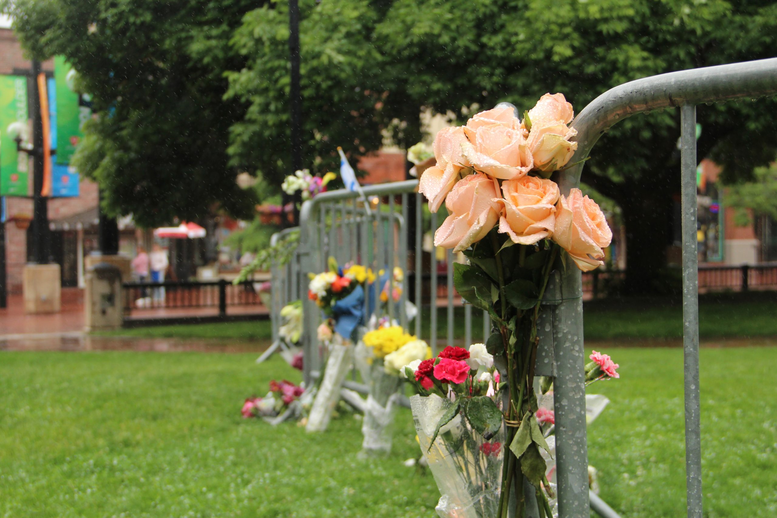 Flowers set out near the site of the antisemitic attack in Boulder that took place on June 1, 2025. Credit: Brooke Stephenson