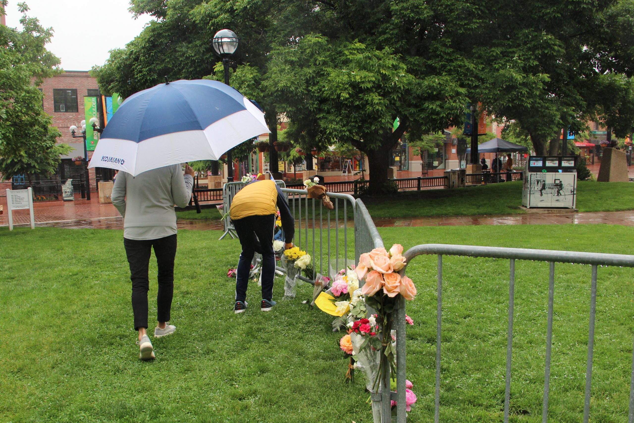 Boulder residents place a bouquet for victims of the June 1 attack in Boulder. Credit: Brooke Stephenson