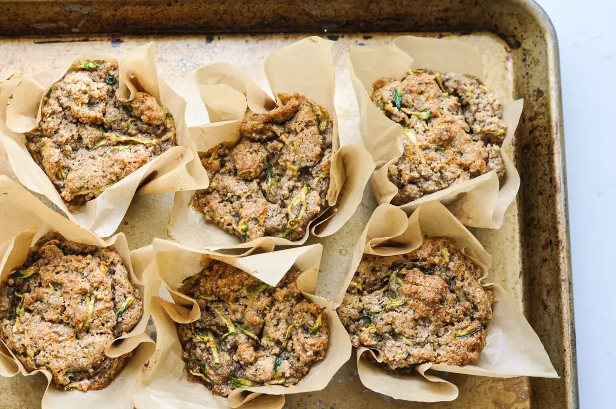 baking tray with 6 zucchini spice muffins