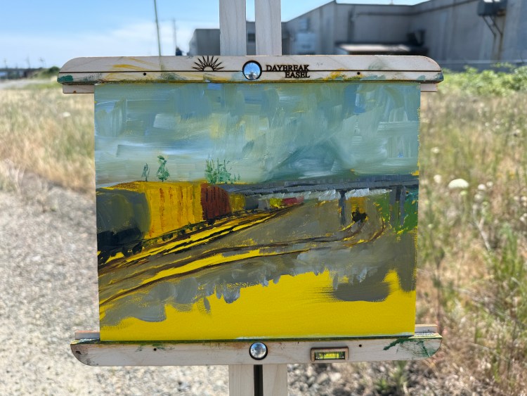 Impressionistic landscape painting of a Union Pacific rail yard with overhead wires and distant hills