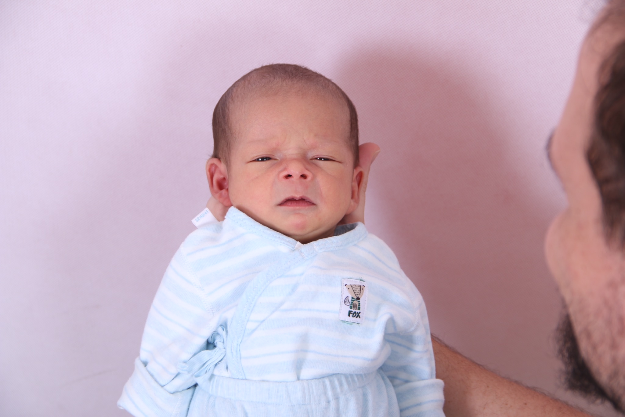 This is us taking a photo for his passport photo!