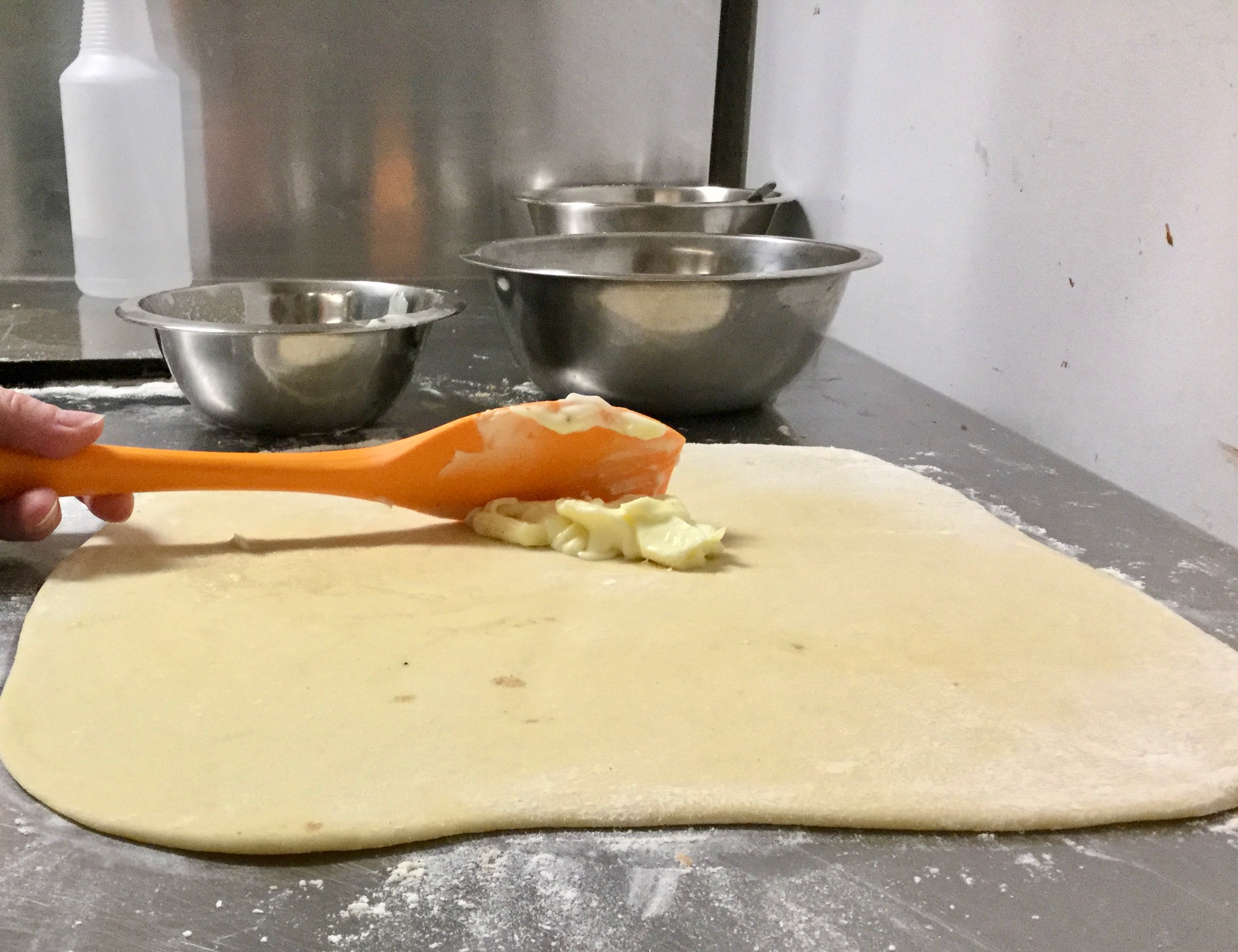 Spread butter over rolled dough