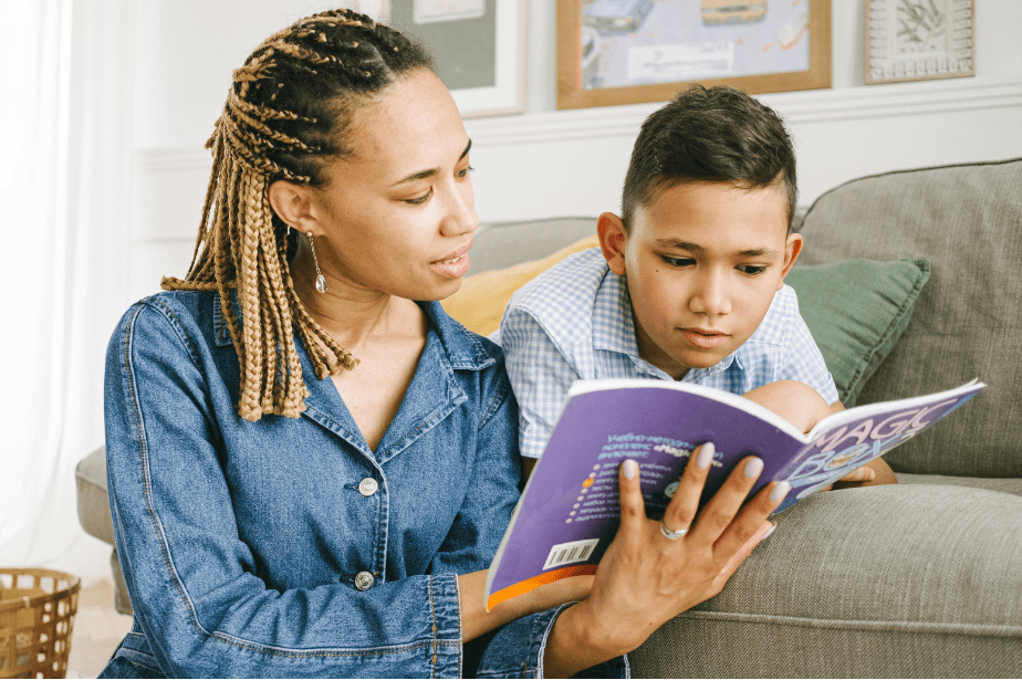 Child sounding out words with mom