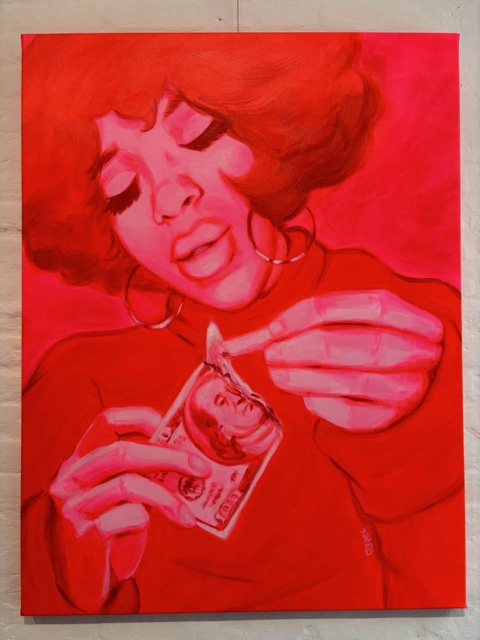 Portrait of a woman lighting a 100 dollar bill on fire