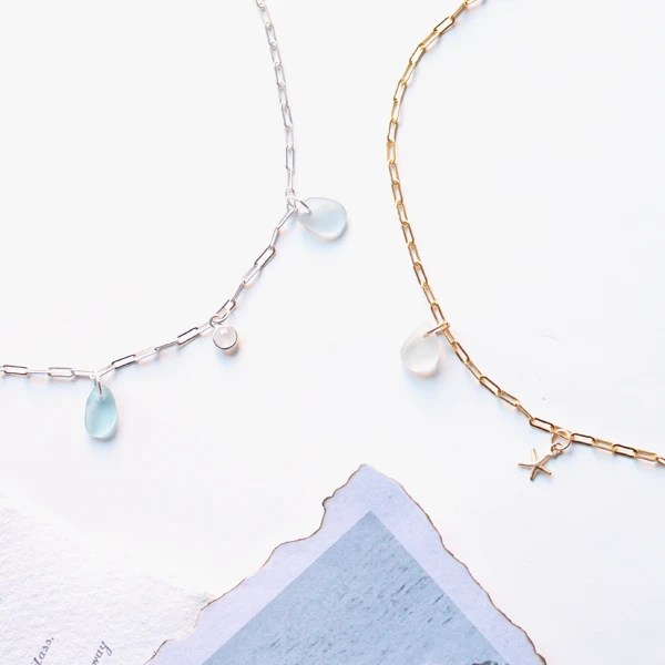 14k Gold filled necklace next to Sterling Silver necklace