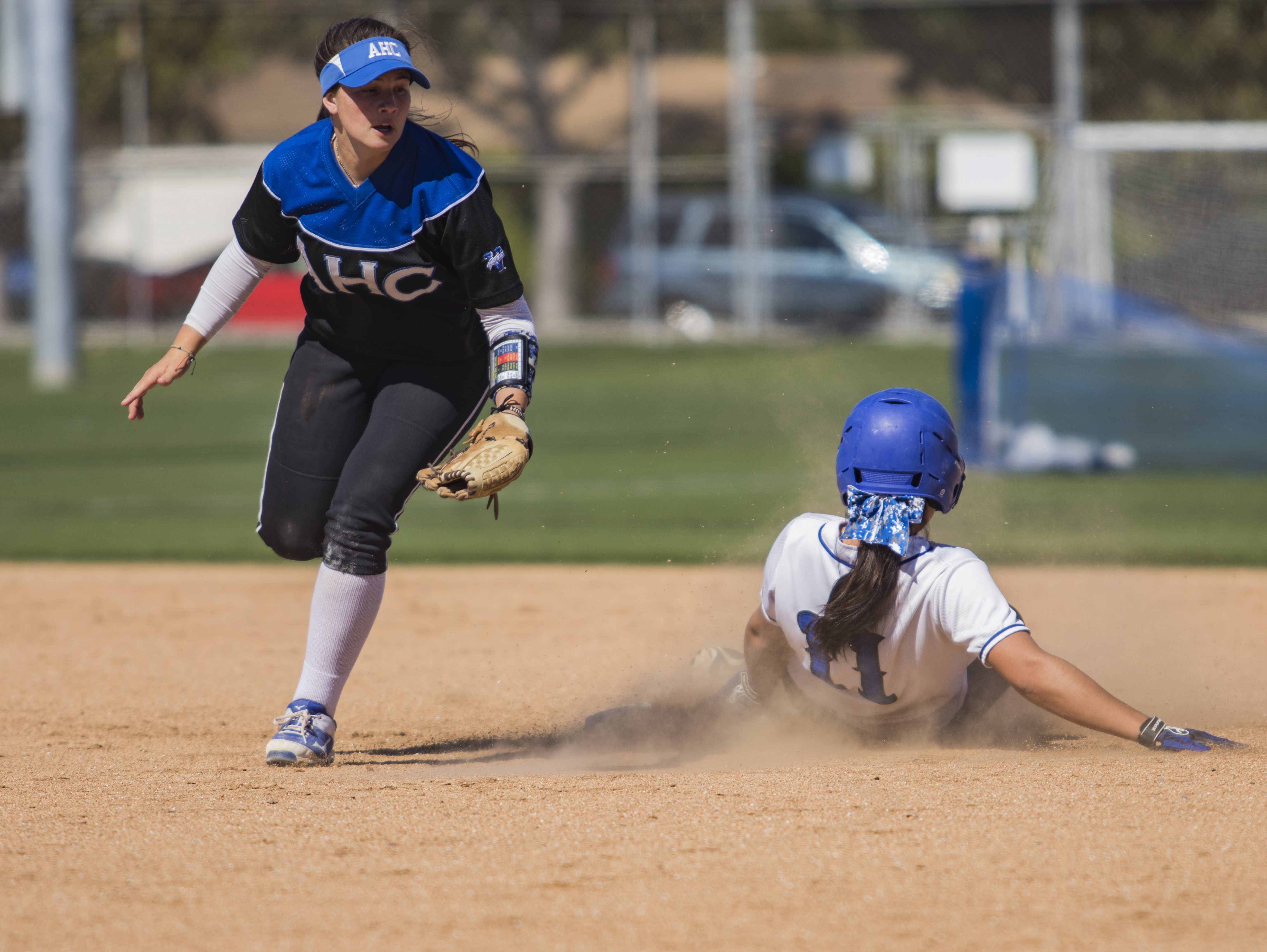 Santa Monica Corsair player Sam Soto (#11) right, sliding for second base during Tuesday, March 27, 2018, game against the Allan Hancock Bulldogs at John Adams Middle School in Santa Monica, California. The Corsair fell 8-1 to the Bulldogs. (Brian Quiroz // Corsair Staff)