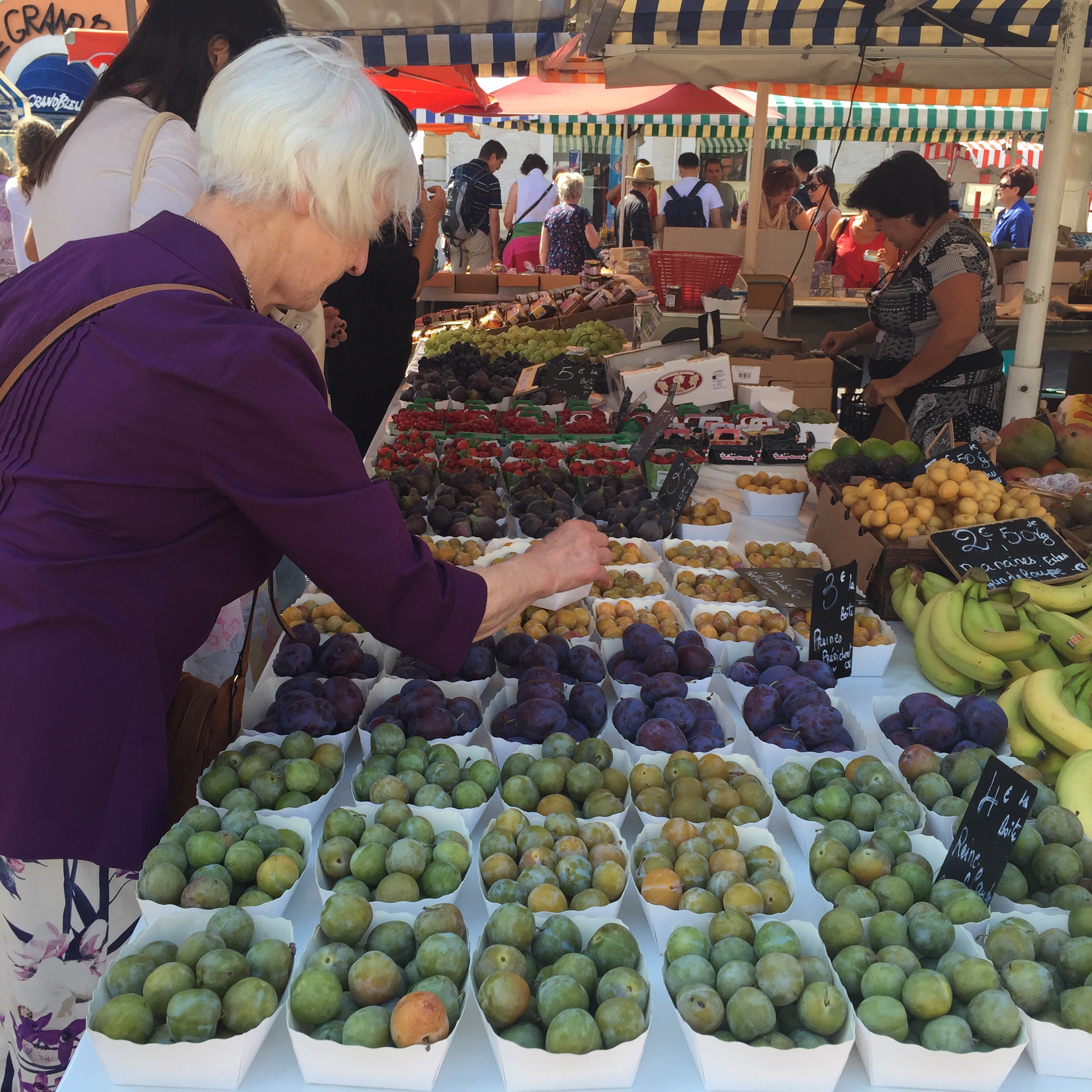 Selecting just the right plums for a galette.