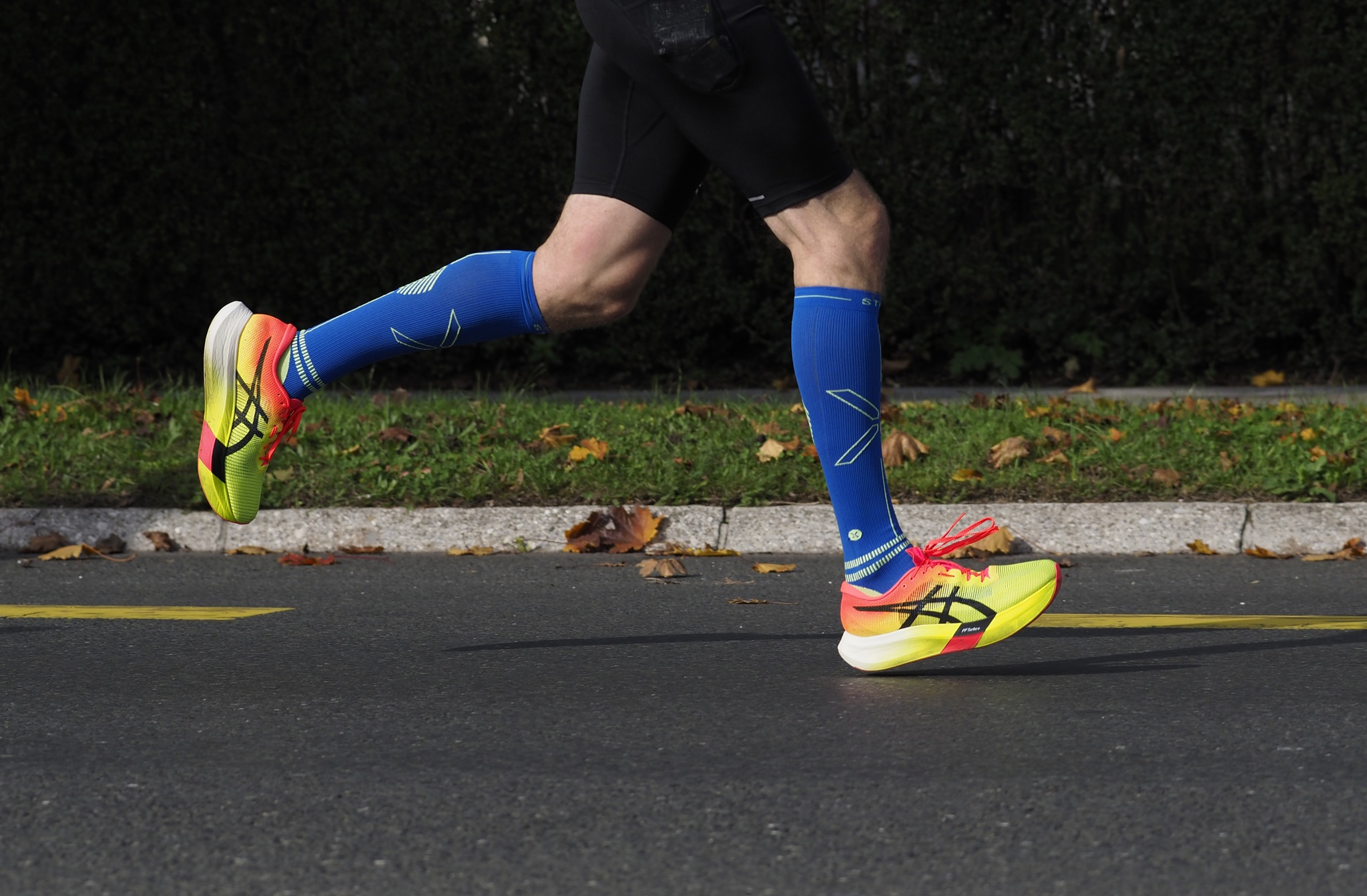 The bottom half of an athlete on a run.