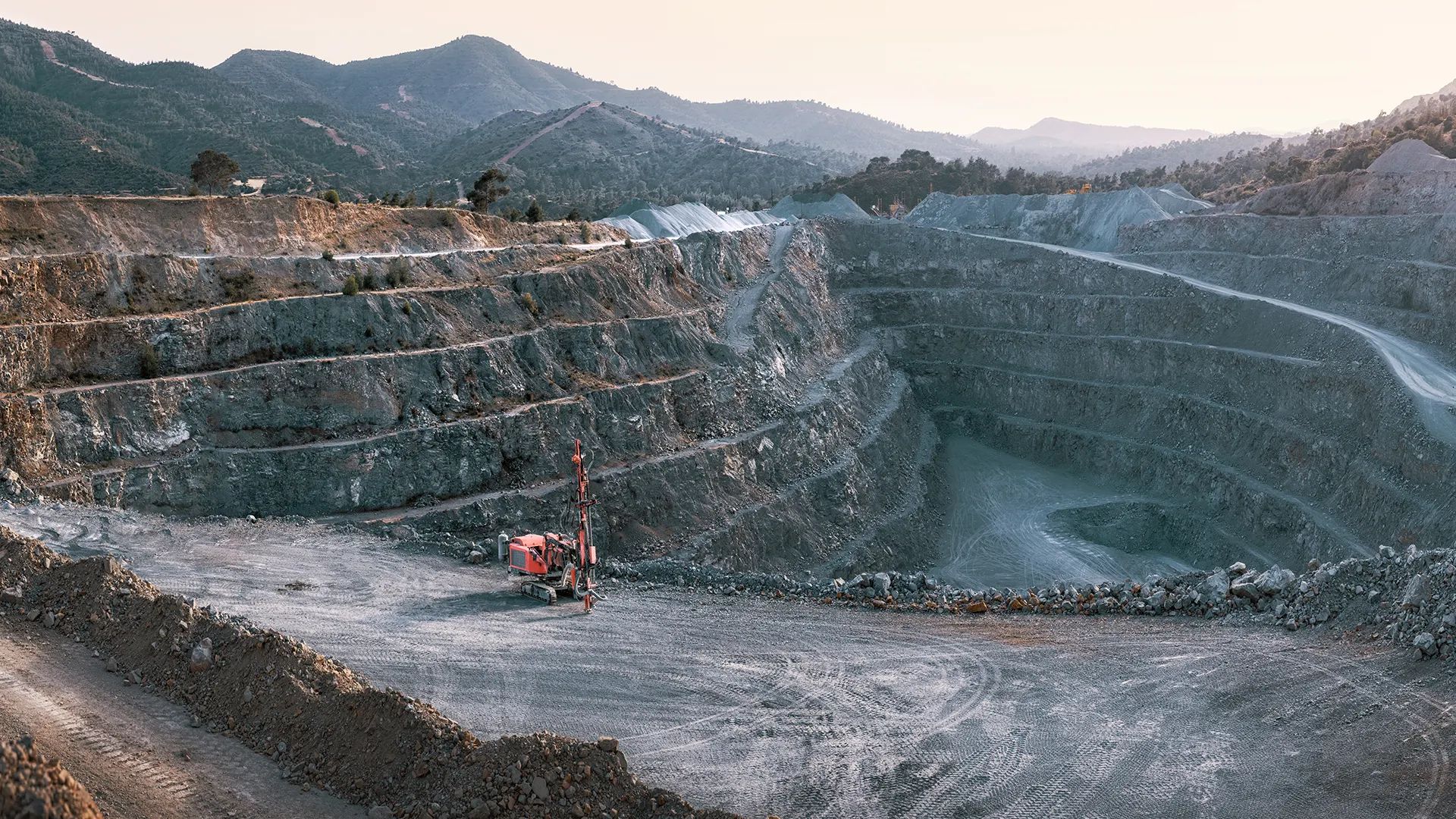 Large open pit mine showing surface mining methods used for mineral extraction