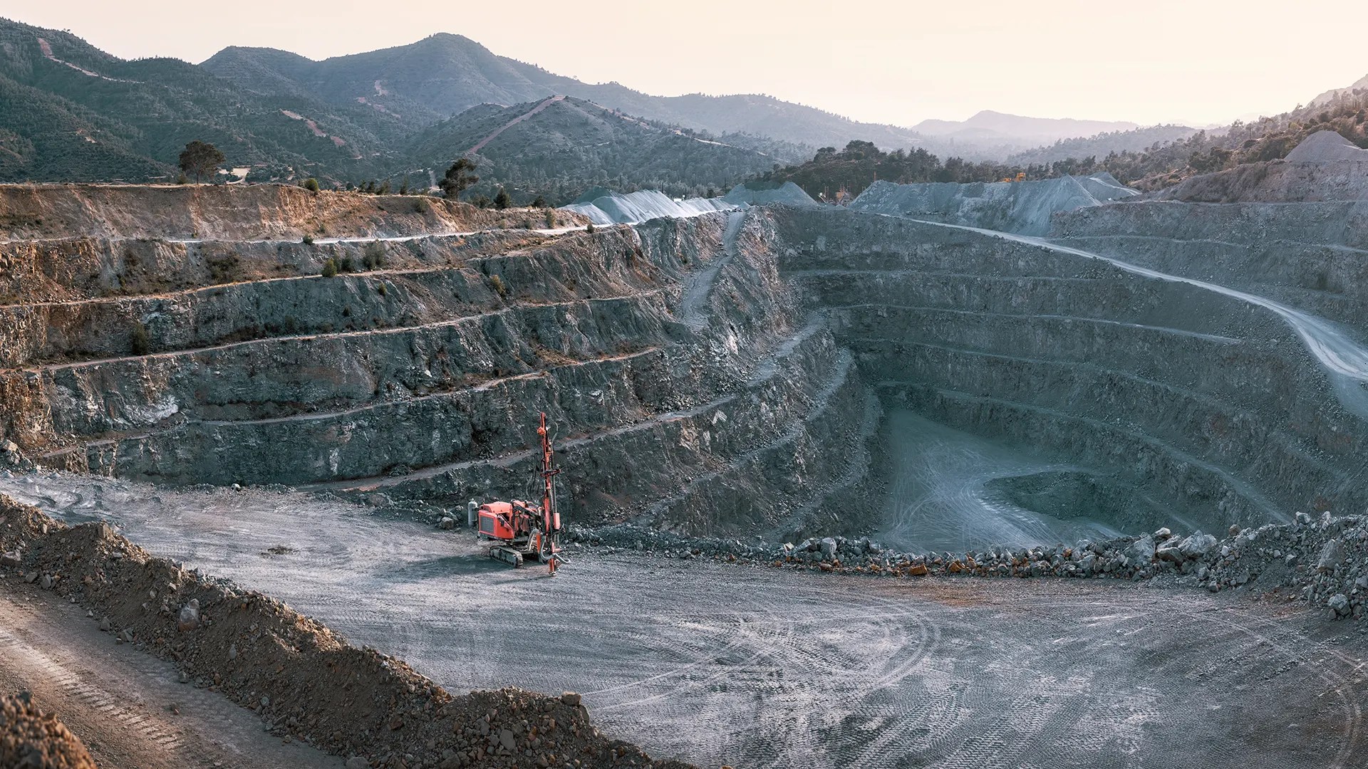 Large open pit mine showing surface mining methods used for mineral extraction