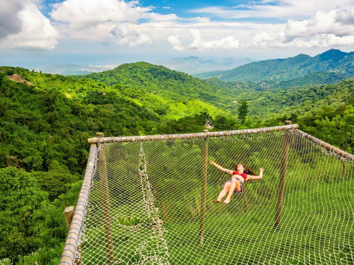 Girl laying in giant hammock Minca Casa Elemento Colombia