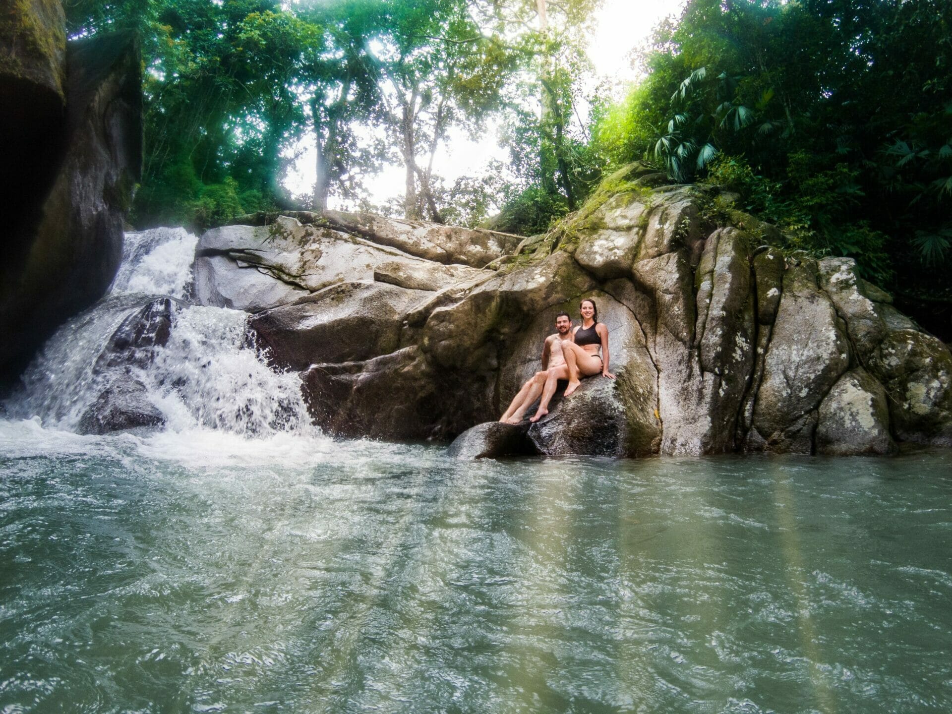 couple swimming waterfall Minca Colombia