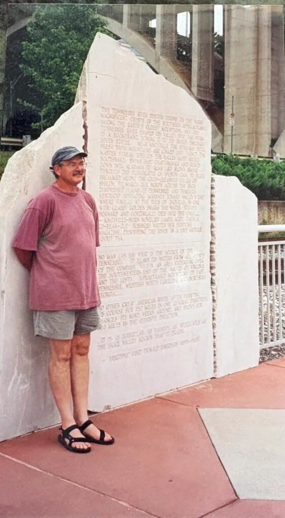 Bruce Bennett beside the James Agee and Donald Davidson Story Stone at Volunteer Landing in Knoxville