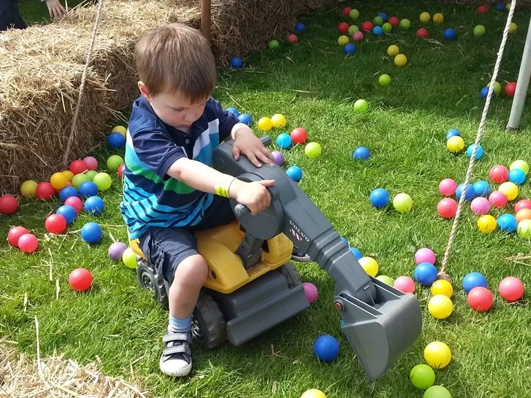 scooping balls in a digger