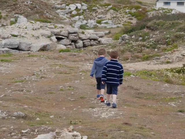 2 boys exploring Portland Bill rocks